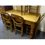 19c pine dining table with a set of 4 x 19c balloon backed chairs with elm seats