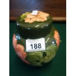 Green glazed ginger jar and lid from William Moorcroft, impressed Moorcroft mark and monogrammed