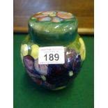 Vintage Moorcroft Ginger Jar and lid, decorated with Pansies to the exterior, impressed blue