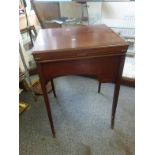 Pettit metamorphic Edwardian mahogany fold out writing unit, on slender tapering supports, the table
