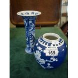 Blue and white Oriental vase, void of lid and a blue and white Delft vase with a damaged rim