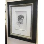 Ronnie Wood (from the Rolling Stones) a stunning charcoal drawing, a portrait in profile, original