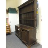 Mid 18 th century Welsh oak Low Dresser with a cluster of 2 cupboards and 3 drawers to the centre