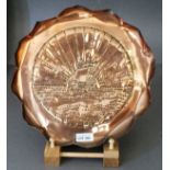 Eustace Bros. Copper Tray of circular scalloped design decorated a Viking ship with sunburst, 12"