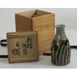 Shoji HAMADA (1894-1978), A stoneware Saki Bottle the body with spiral stripe glazing applied by