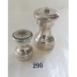 Two churn shaped pepper mills marked sterling