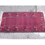 Red ground Belouche rug 4'8” x 2'3”