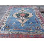 A blue ground carpet with centre medallions 11'4” x 8'6”