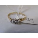 A three stone 18ct diamond ring 1.2g approx size 'O'