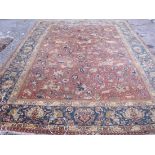 AN EASTERN CARPET WITH EQUESTRIAN FIGURES HUNTING DEER & BOAR ETC 11'4” X 8'4”