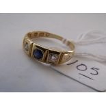 A sapphire & diamond three stone ring