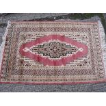 A pink ground modern rug 4' x 2'6”