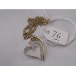 A witches heart diamond set pendant on 9ct chain 2g