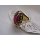 A marquis shaped red stone & diamond 18ct dress ring approx size 'O'