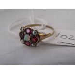An antique ruby, pearl & opal set ring approx 'K'