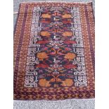 A fine quality rug with birds within a wide border 4'4” x 3'2”