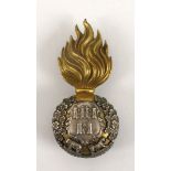 Early 20th century Royal Dublin Fusiliers officer's bearskin badge. A brass and white metal badge,