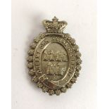 A pre-1881 Queen's Own Royal Regiment, Dublin City, glengarry badge A white metal oval badge,