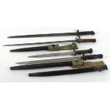 1914 -1919 collection of four bayonets A British 1888 pattern knife bayonet and scabbard for use