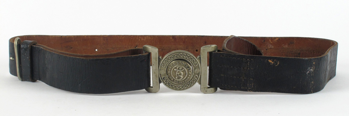 1920s Garda uniform belt and whistle A black leather belt with white metal two-piece buckle