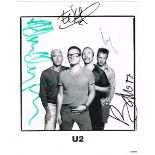 U2 Publicity photograph signed by all four members and a VIP badge for The Joshua Tree concert at