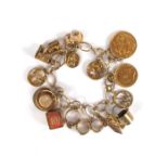 A gold charm bracelet incorporating a George V sovereign and a Edward VII half-sovereign. Total