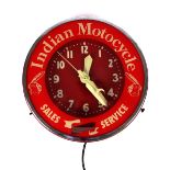 Indian Motorcycles dealership clock. A red, white and chrome circular metal wall clock, the outer