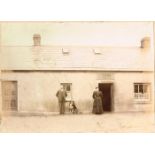 Early 20th century, photographs of pubs. A 6 x 8" black & white photograph of a man, woman and a dog