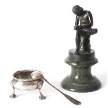1760 a Georgian silver salt and a bronze figure of a youth. The circular salt with gadrooned rim, on