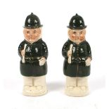 Victorian Staffordshire figures of policemen A pair of Staffordshire earthenware figural pepper pots
