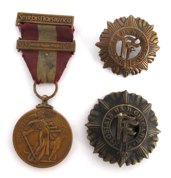 An Oglaigh na hEireann helmet badge, an Oglaigh na hEireann cap badge and a 1939-1946 Emergency - Image 2 of 2