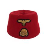 1939-1945 German Third Reich, M43 SS red fez. With eagle and swastika and deaths head badges.