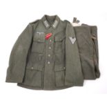 1939-1945 German Third Reich, Wehrmacht field-grey uniform tunic and trousers. A late-war