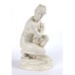 1891-1926 Belleek, Crouching Venus sculpture. the classical female figure depicted leaning on one