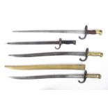 Late 19th century, a collection of four French bayonets. (4) A Yataghan sword bayonet for use on the