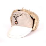 1939-1945 German Third Reich, Luftwaffe sheepskin field cap. With hand-embroidered Luftwaffe eagle