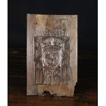 A 15th Century Oak Panel carved with Gothic tracery centred by a crowned armorial sheild emblazoned