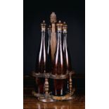 An Early 19th Century Cruet Set comprising of four brown glass 'Alsace' bottles with finialed cork