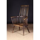 An 18th Century Primitive Ash & Elm Comb-back Windsor Armchair attributed to the West Country.