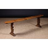 A Long 19th Century Cherrywood Bench.