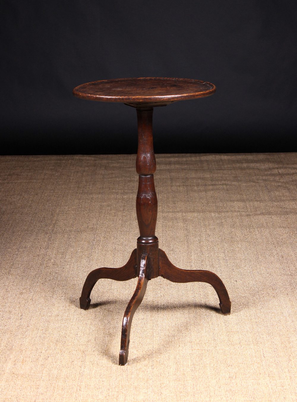 A George III Oak & Elm Tripod Table of good colour & patination.