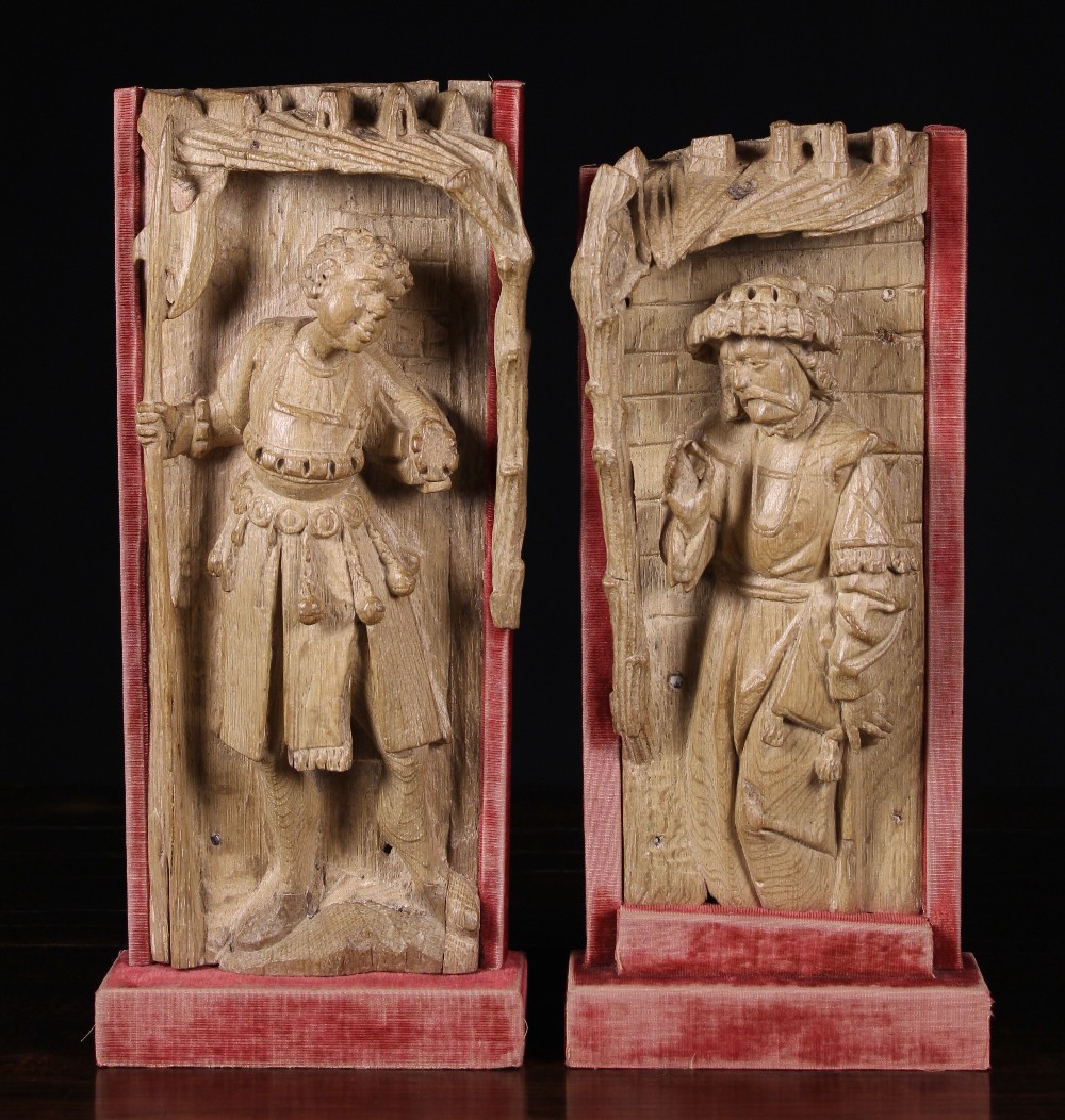 A Pair of 16th Century Antwerp Retable Fragments: One carved with the figure of a guard with