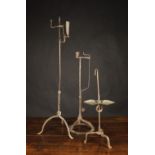 Three Wrought Iron Candle/Rush Lamps: An 18th century floor standing candle light with height