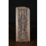 A Small 16th Century Oak Panel carved with Gothic tracery ornamentation and measuring 15½ ins x 6¼