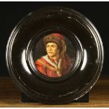 A Round Oil on Canvas laid onto Board: Head & shoulders Portrait of a Renaissance man,