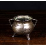 A Small 17th Century Bronze Cauldron with triangular lug handles, 4½ ins (11.