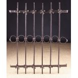 An Antique Wrought Iron Window Grill composed of seven vertical bars joined by a central row of