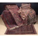 A Collection of Five Old Carpets (A/F): A brown and aubergine ground rug woven with two rows of