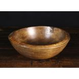 A 19th Century Turned Treen Bowl, 5 ins (13 cms) high, 13 ins (33 cms) diameter.