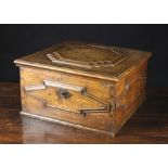 An 18th Century Oak Box with raised geometrically moulded panels.